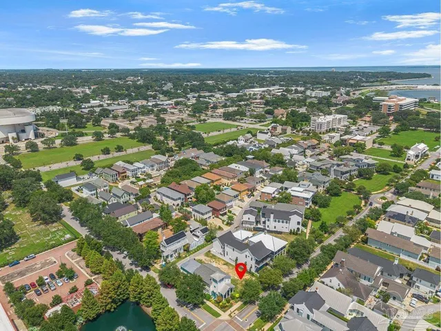 an aerial view of residential houses with outdoor space