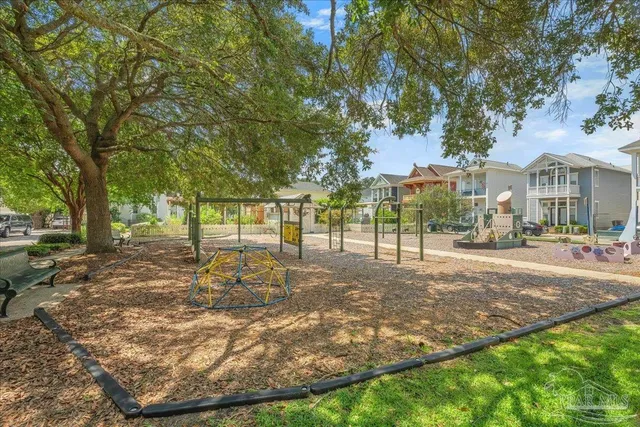 a view of a yard with a house in the background