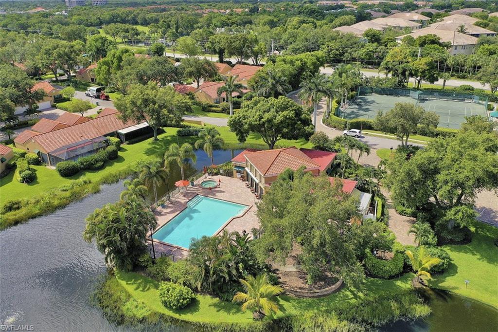 714 Reef Point Circle Naples, FL 34108 - Photo 20 of 27 an aerial view of residential house with outdoor space and swimming pool