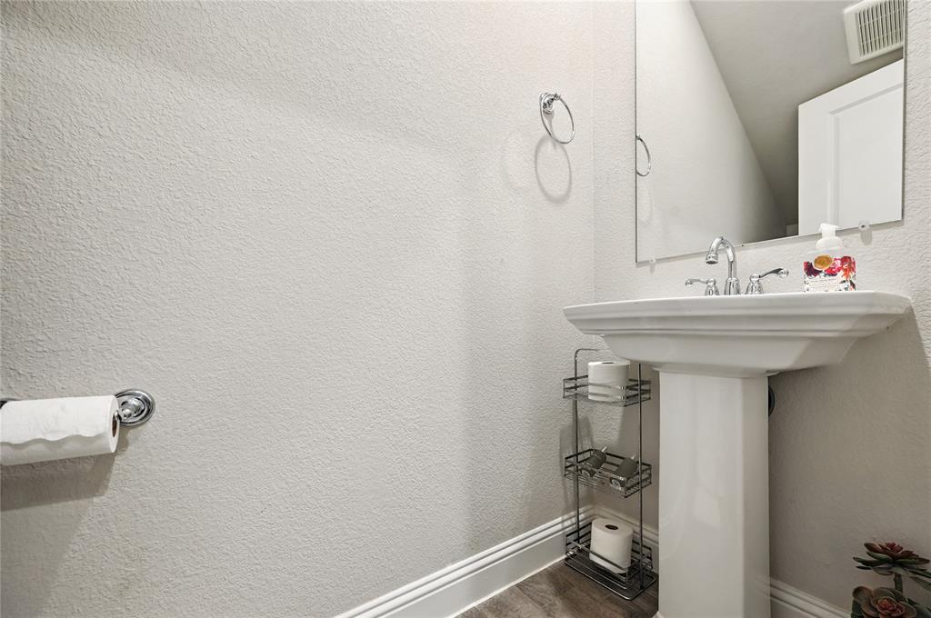 1160 Red Hawk Lane Forney, TX 75126 - Photo 13 of 33 a bathroom with a sink and mirror