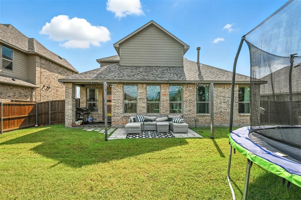 1160 Red Hawk Lane Forney, TX 75126 - Photo 21 of 33 a view of a house with a yard and sitting area