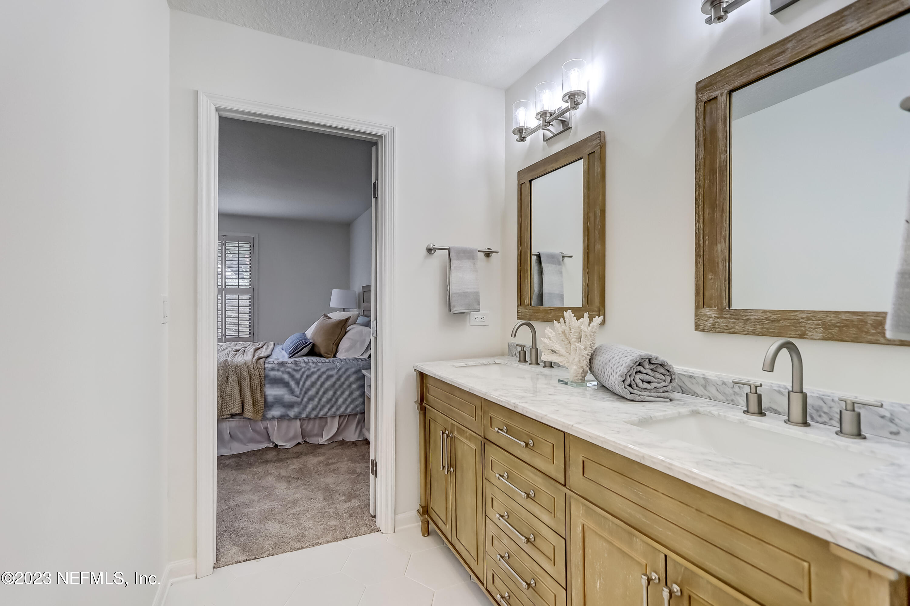 41 Turtleback Trail Ponte Vedra Beach, FL 32082 - Photo 25 of 41 a en suite bathroom with double vanity sinks and a mirror
