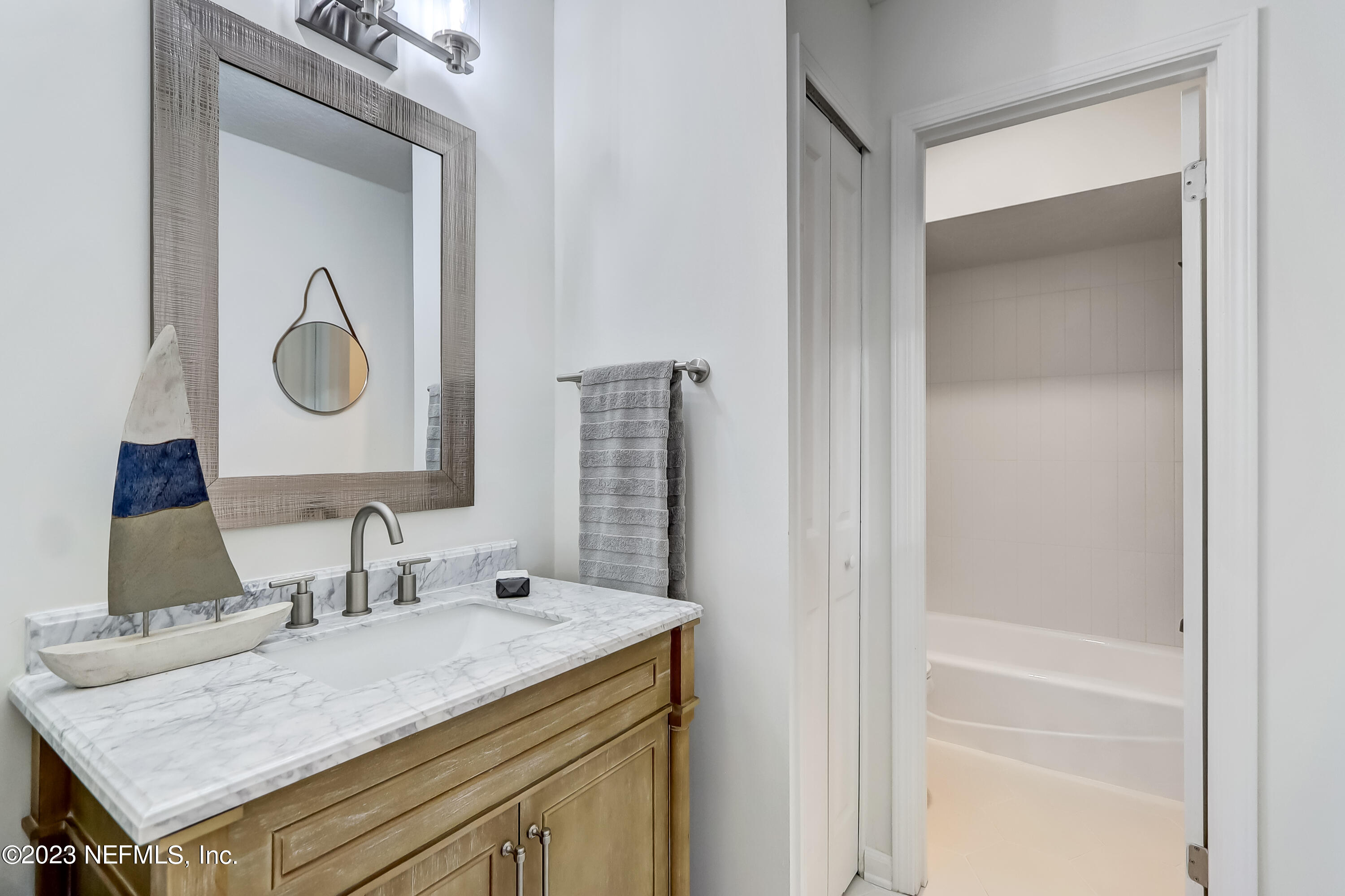 41 Turtleback Trail Ponte Vedra Beach, FL 32082 - Photo 30 of 41 a bathroom with a granite countertop sink and a mirror
