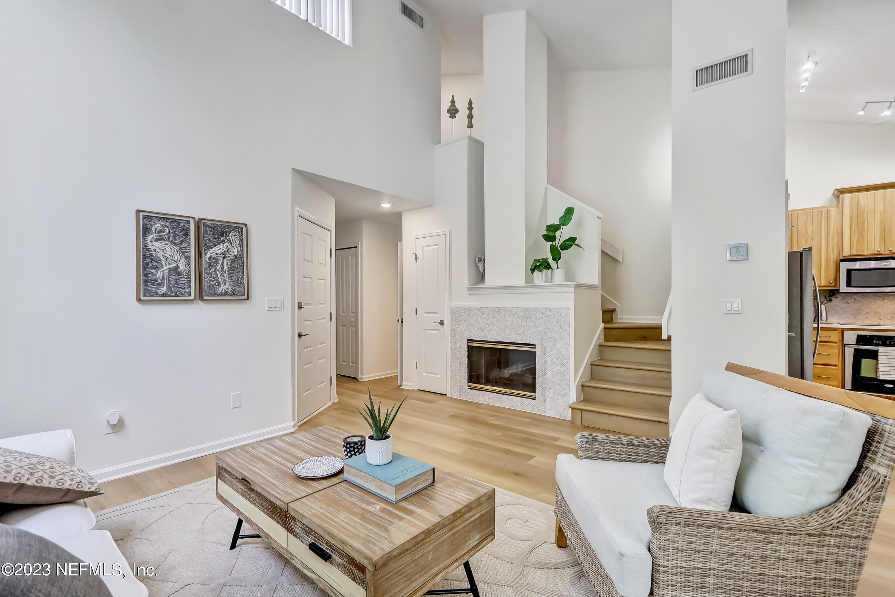 41 Turtleback Trail Ponte Vedra Beach, FL 32082 - Photo 3 of 41 a living room with furniture a fireplace and a table