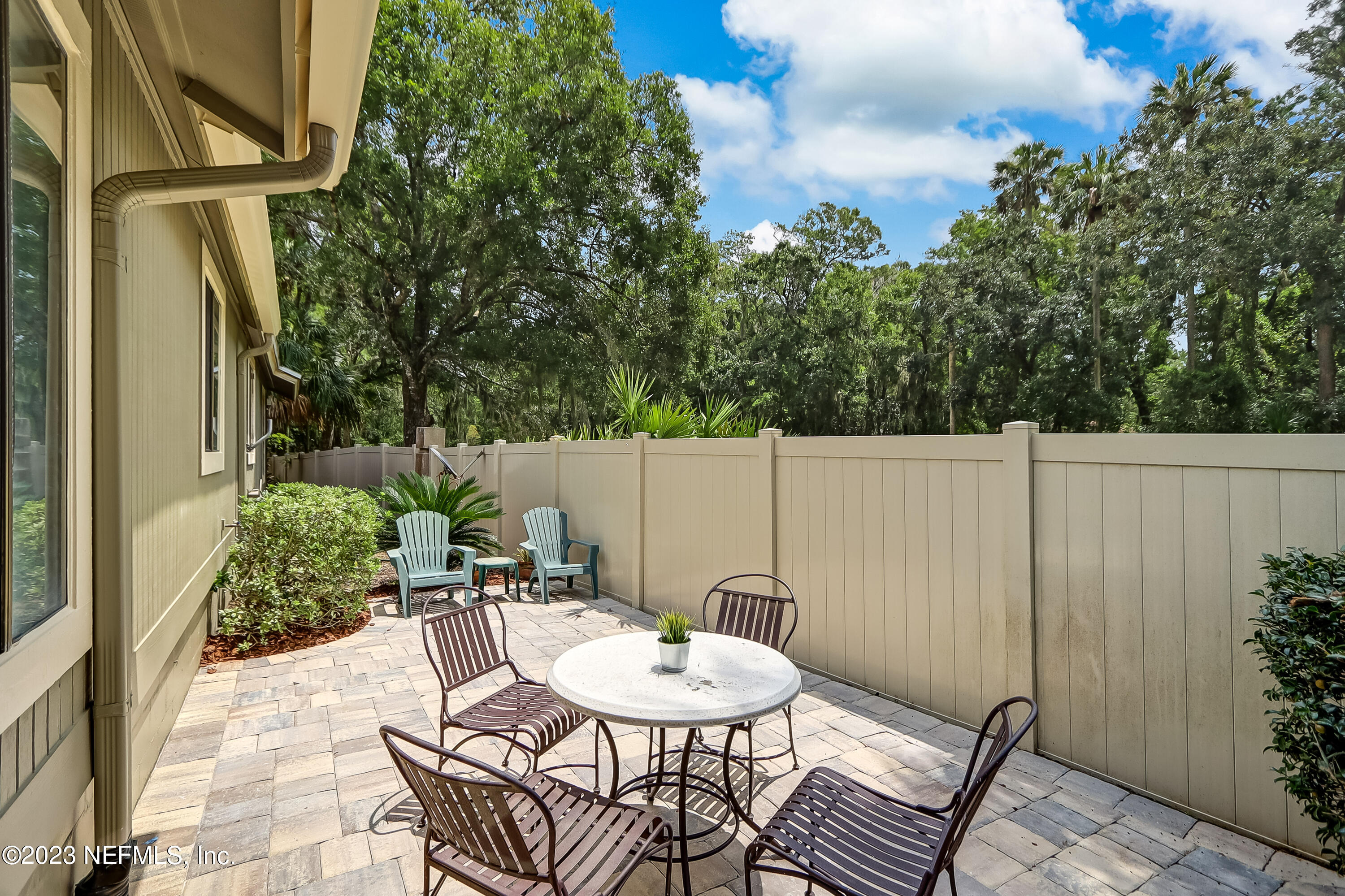 41 Turtleback Trail Ponte Vedra Beach, FL 32082 - Photo 35 of 41 a backyard of a house with table and chairs