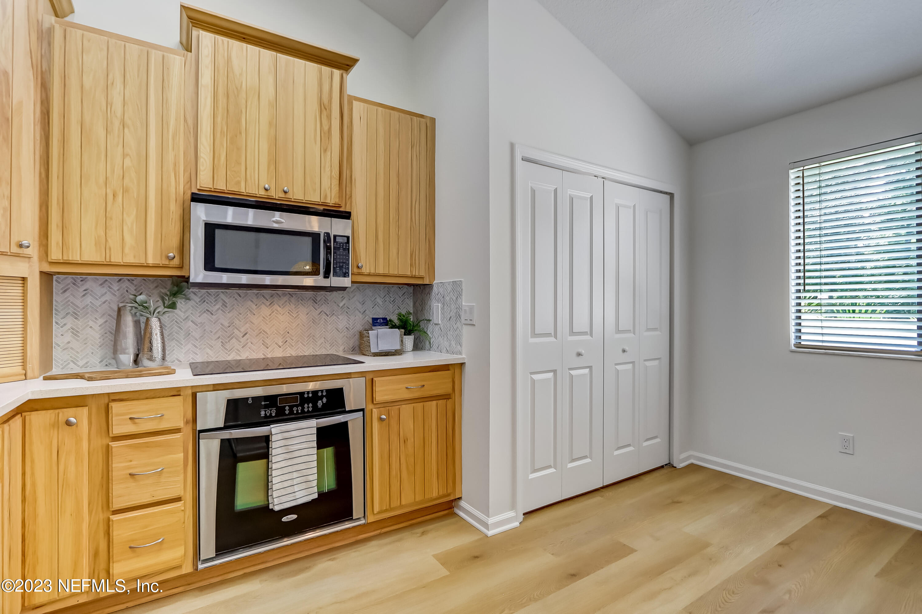 41 Turtleback Trail Ponte Vedra Beach, FL 32082 - Photo 10 of 41 a kitchen with stainless steel appliances granite countertop a stove a microwave and cabinets