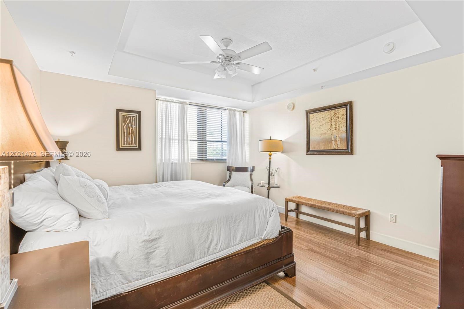 8395 Southwest 73rd Avenue, Unit 710 Miami, FL 33143 - Photo 16 of 32 a bedroom with a bed and wooden floor