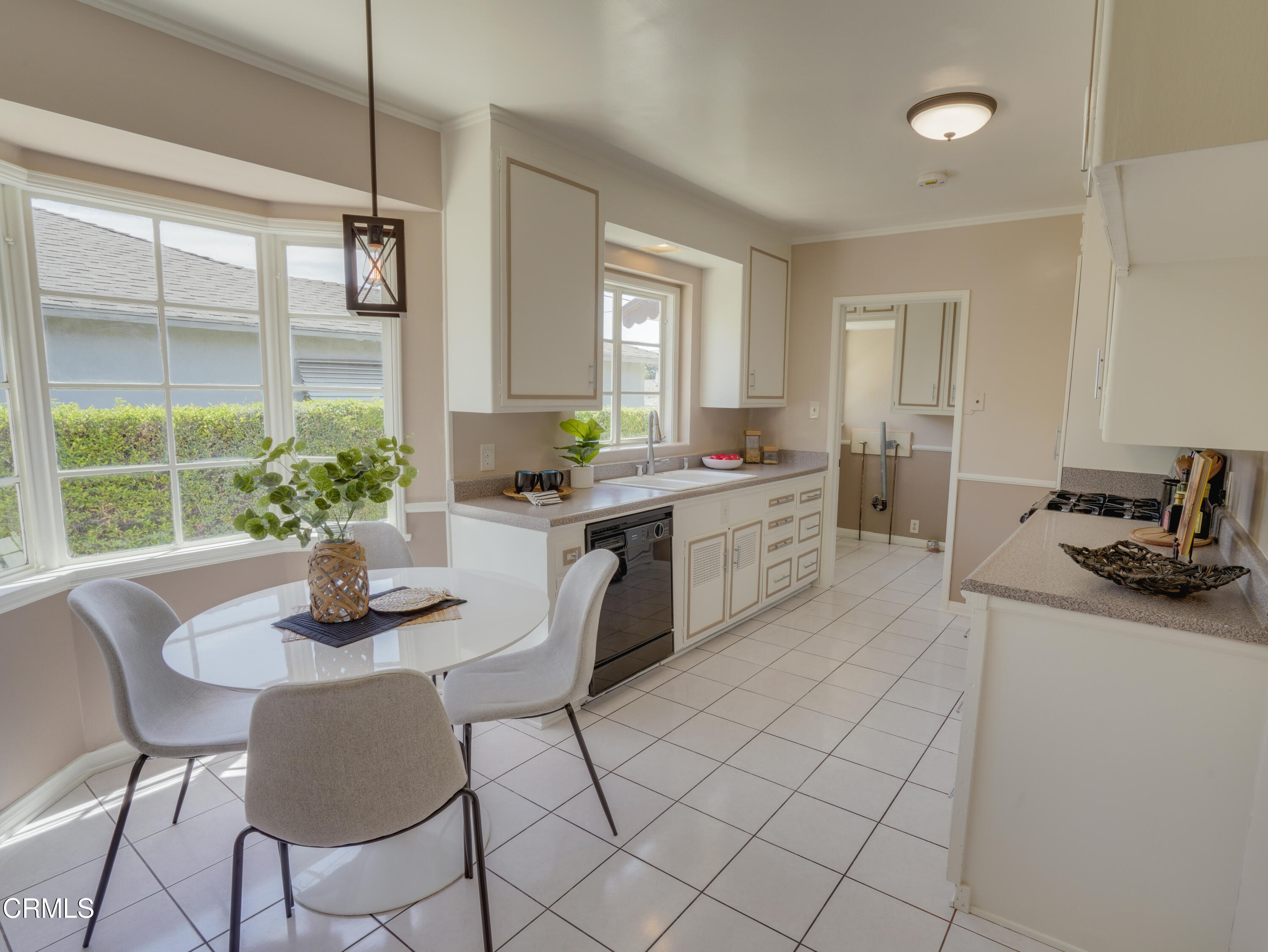 2540 Lambert Drive Pasadena, CA 91107 - Photo 12 of 30 a kitchen with stainless steel appliances granite countertop a sink a stove a dining table and chairs