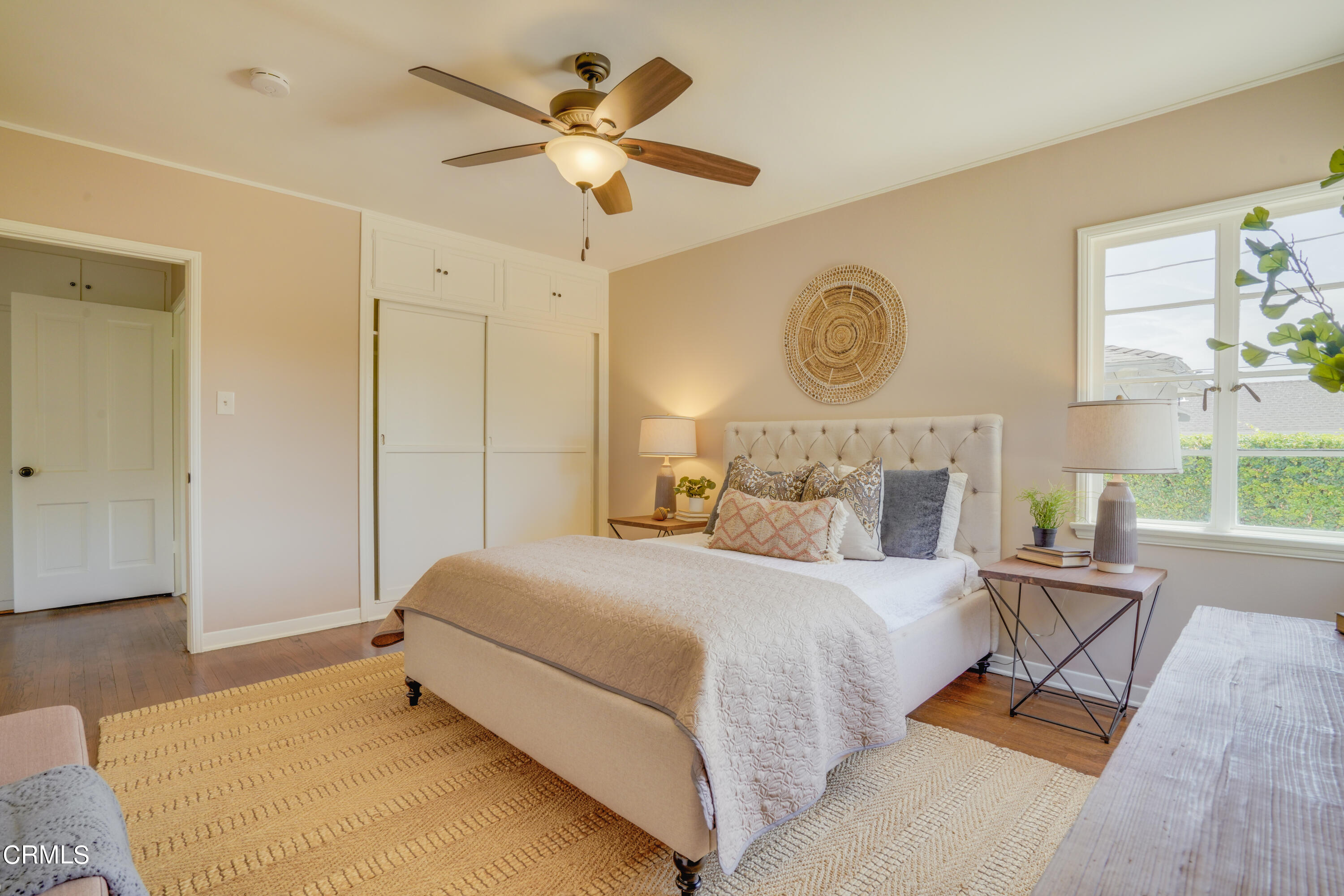 2540 Lambert Drive Pasadena, CA 91107 - Photo 20 of 30 a bedroom with a bed mirror on desk and a window