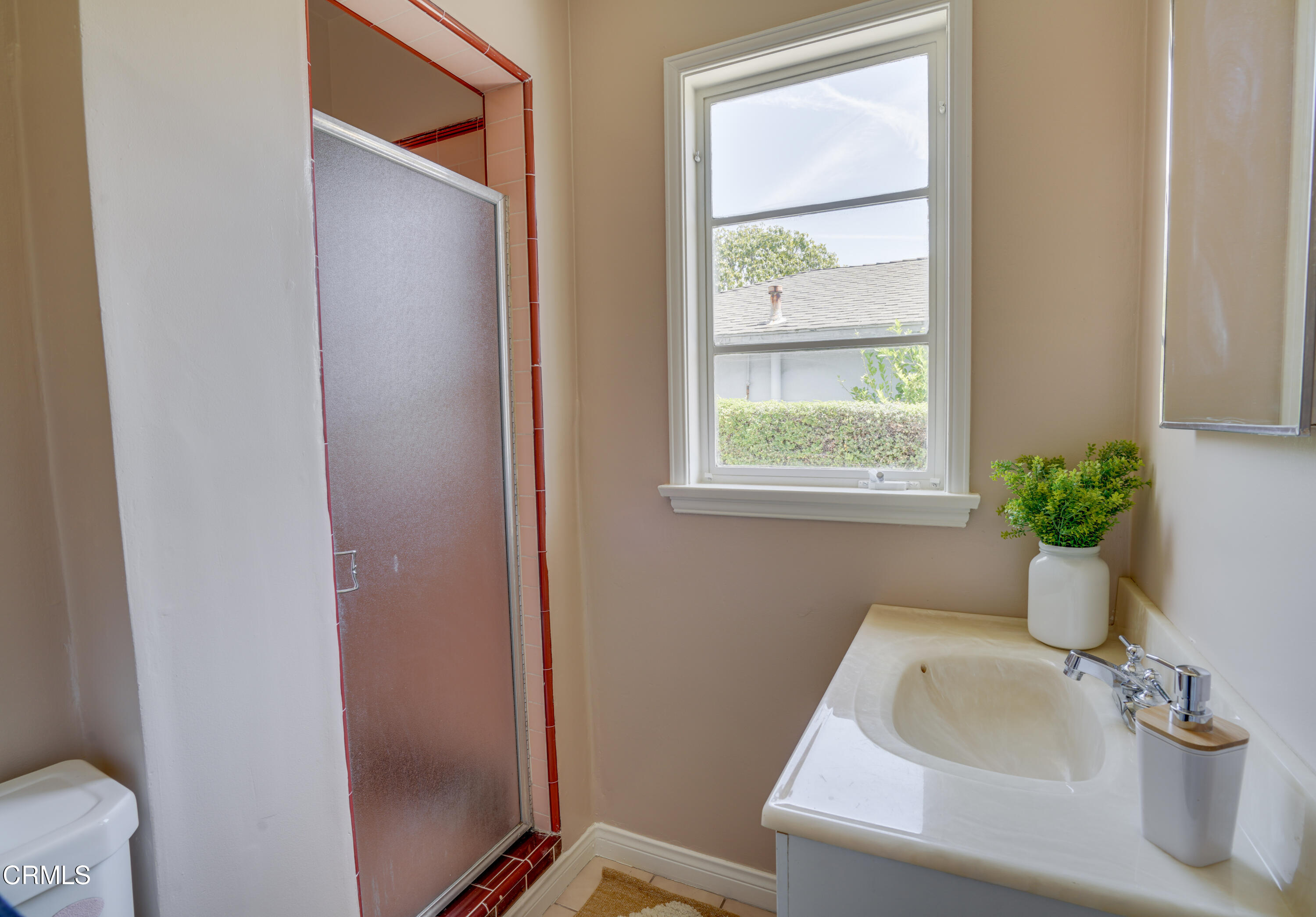 2540 Lambert Drive Pasadena, CA 91107 - Photo 22 of 30 a bathroom with a sink and a window