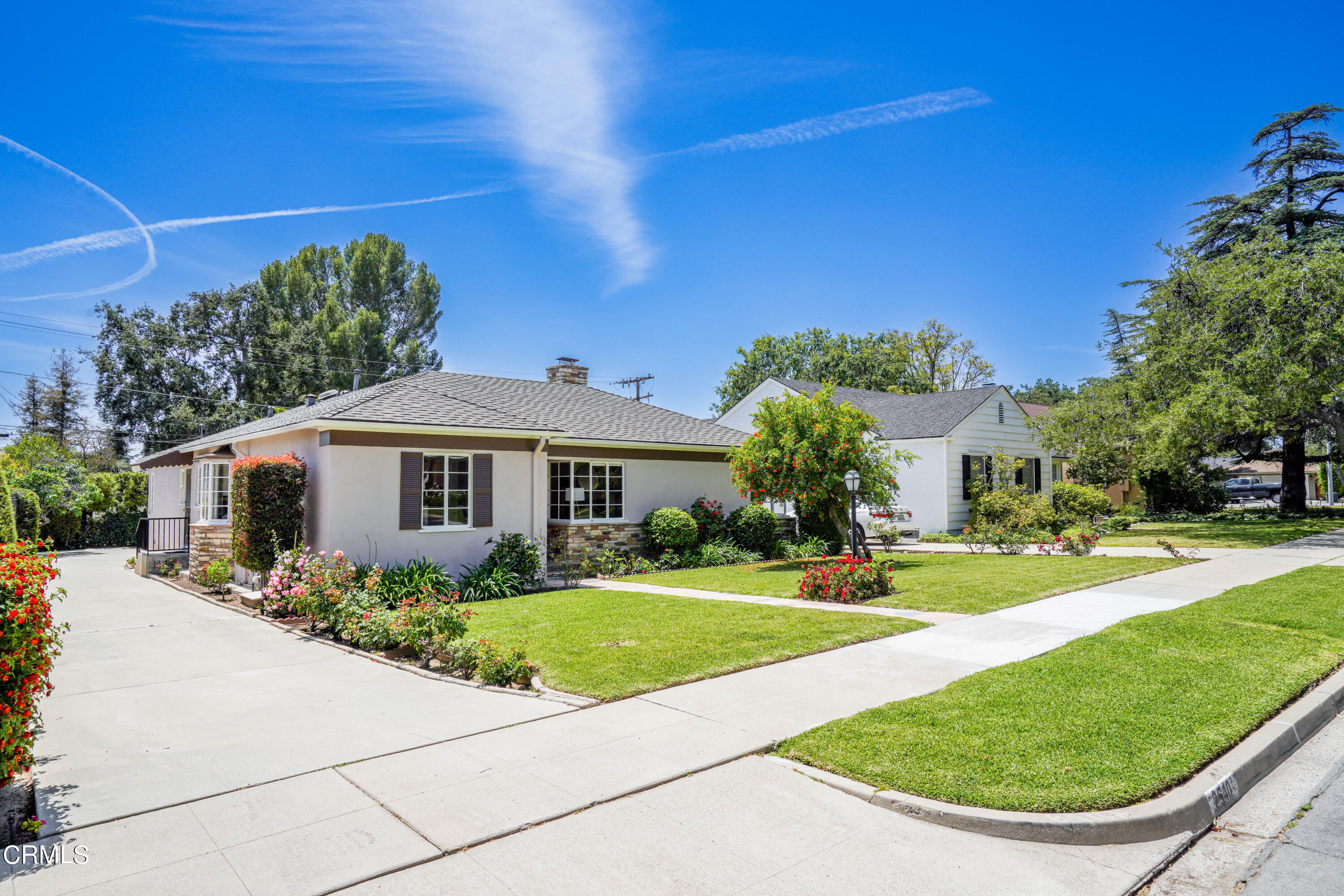 2540 Lambert Drive Pasadena, CA 91107 - Photo 29 of 30 a view of a white house with a big yard and potted plants
