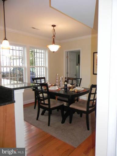 4933 Lee Street Northeast Washington, DC 20019 - Photo 14 of 21 a view of a dining room with furniture and wooden floor