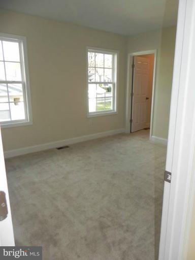 4933 Lee Street Northeast Washington, DC 20019 - Photo 16 of 21 an empty room with windows and closet