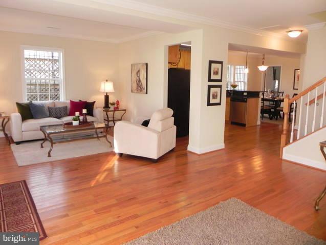 4933 Lee Street Northeast Washington, DC 20019 - Photo 17 of 21 a living room with furniture and a table