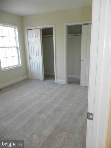 4933 Lee Street Northeast Washington, DC 20019 - Photo 19 of 21 an empty room with windows and closet