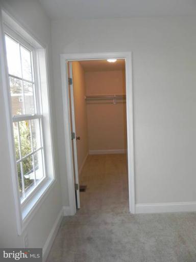 4933 Lee Street Northeast Washington, DC 20019 - Photo 21 of 21 an empty room with windows and closet