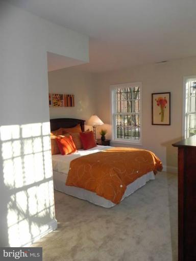 4933 Lee Street Northeast Washington, DC 20019 - Photo 6 of 21 a bedroom with two beds and a window