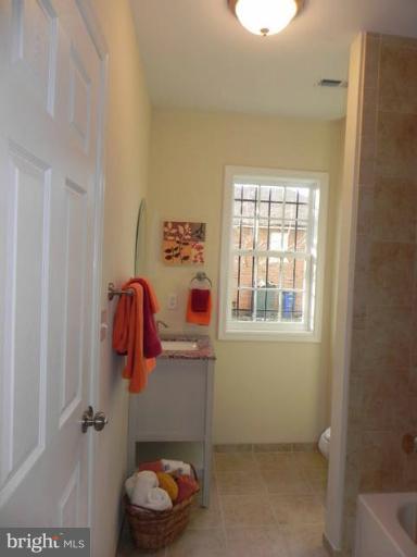 4933 Lee Street Northeast Washington, DC 20019 - Photo 7 of 21 a bathroom with a shower and a sink