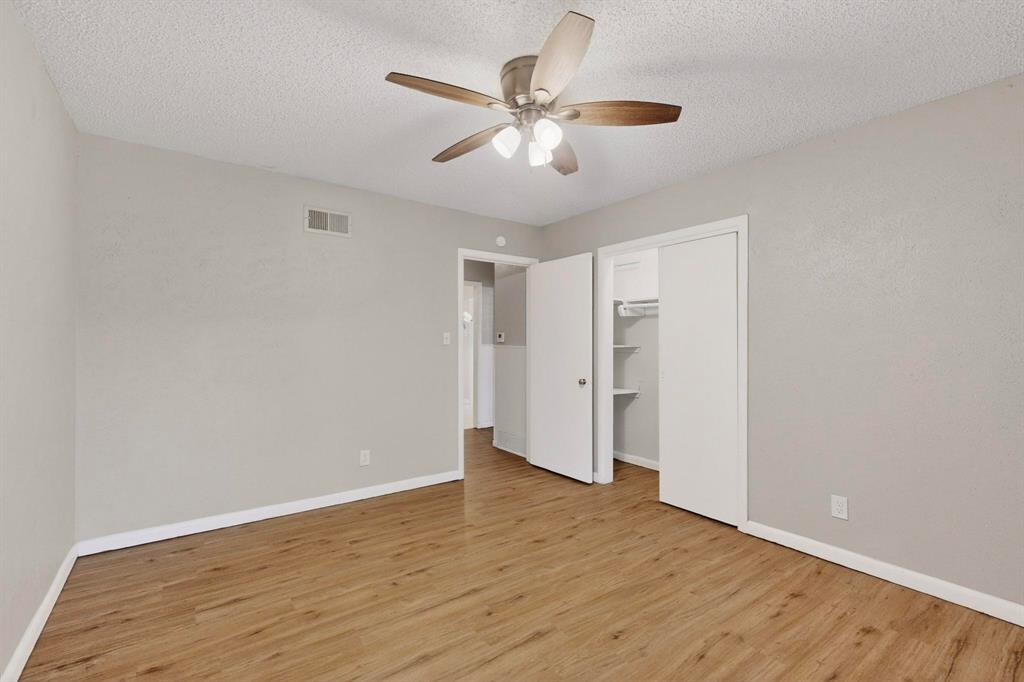 4508 Rutland Avenue Fort Worth, TX 76133 - Photo 21 of 36 a view of an empty room with wooden floor