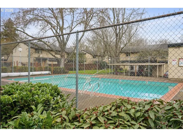 a view of a garden with a house