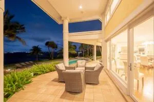 a swimming pool with outdoor seating and yard