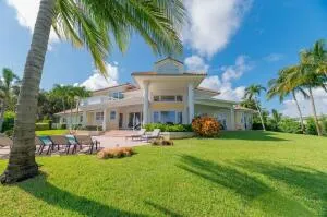 a front view of house with yard and outdoor seating