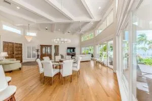 a large white kitchen with a large window