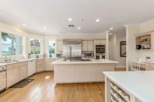 a bathroom with a granite countertop sink and a window