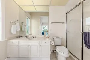 a bathroom with a double vanity sink a mirror and a bathtub