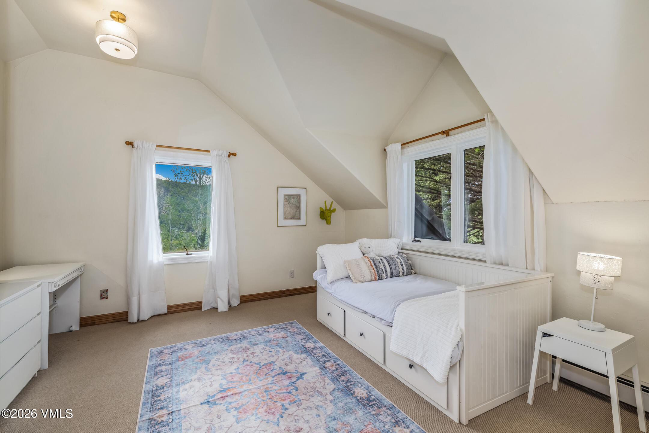 321 Meile Lane Edwards, CO 81632 - Photo 20 of 44 a bedroom with a white bed and a window