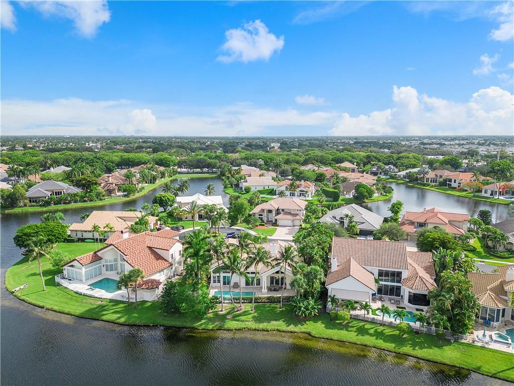 3110 Northwest 63rd Street Boca Raton, FL 33496 - Photo 3 of 62 an aerial view of residential houses with outdoor space and lake view