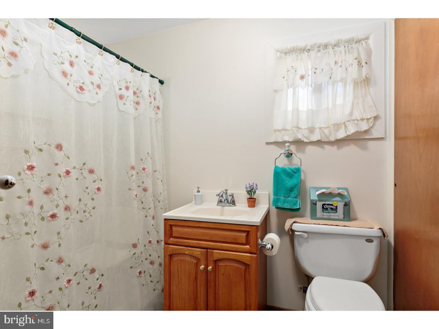 522 Heulings Avenue Riverside, NJ 08075 - Photo 13 of 22 a bathroom with a sink a toilet and a mirror
