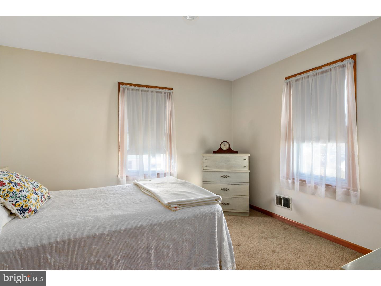 522 Heulings Avenue Riverside, NJ 08075 - Photo 17 of 22 a bedroom with a bed and a window