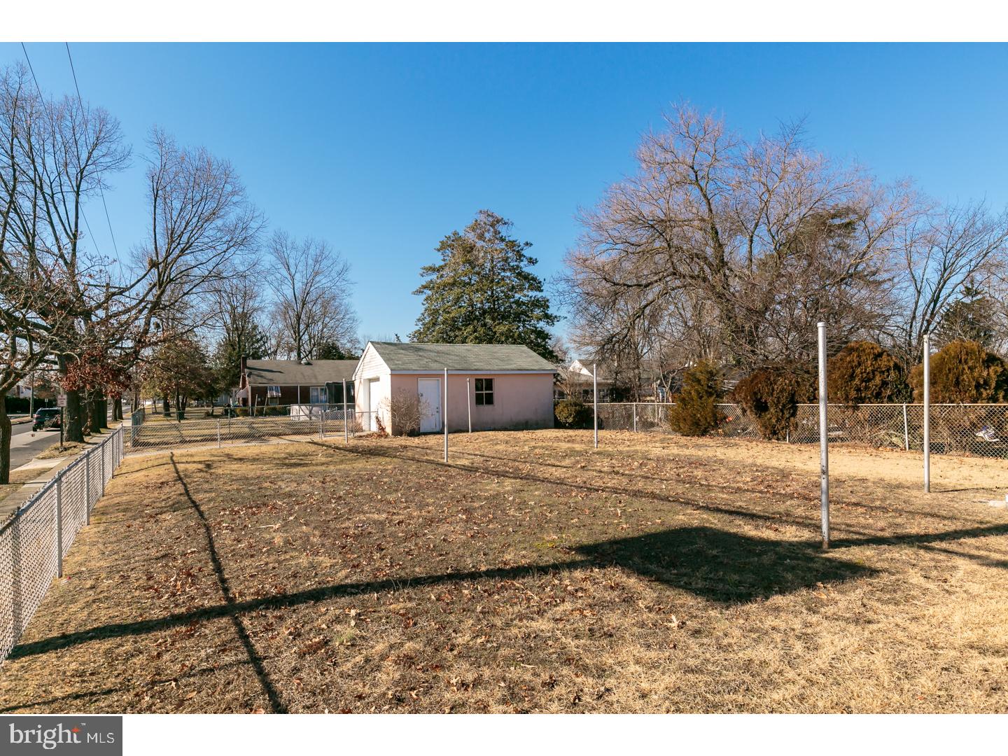 522 Heulings Avenue Riverside, NJ 08075 - Photo 22 of 22 a view of a dry yard with trees