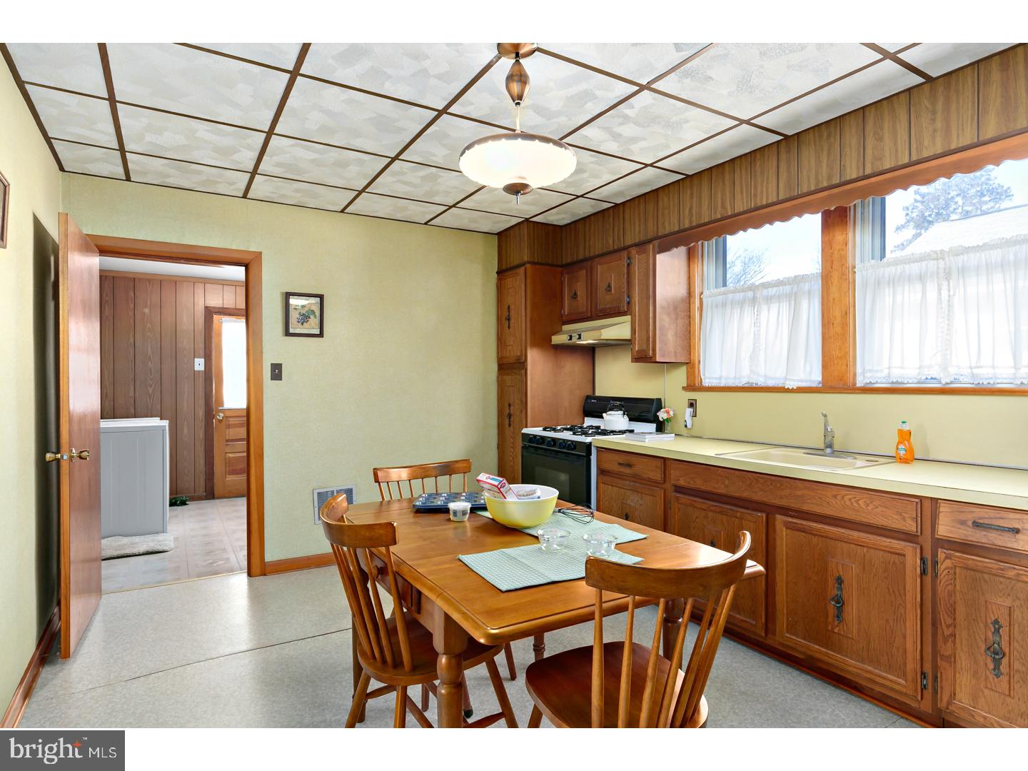 522 Heulings Avenue Riverside, NJ 08075 - Photo 6 of 22 a kitchen with a sink cabinets and window