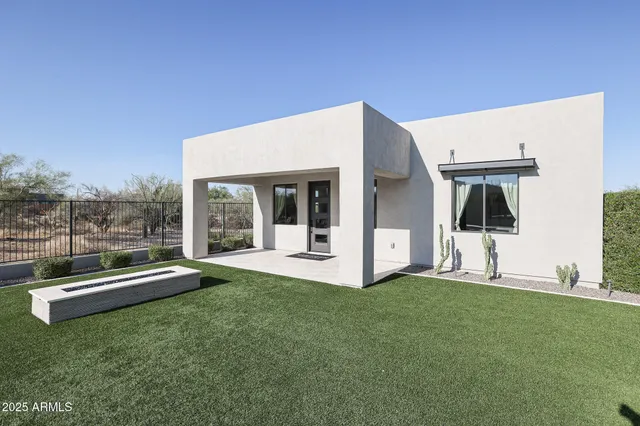 a view of an house with backyard porch and furniture