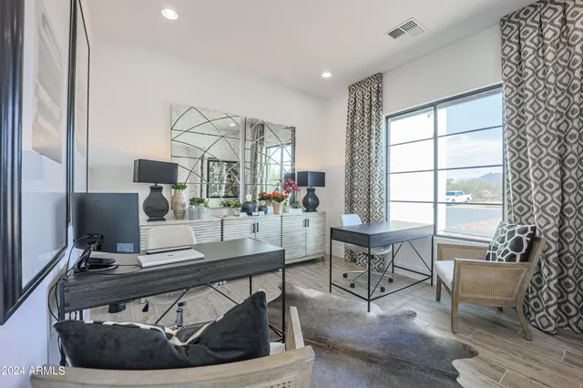 a view of a house with backyard porch and sitting area