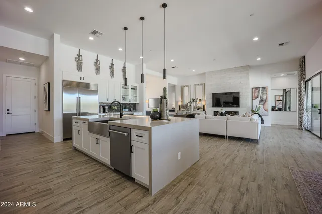 a large kitchen with stainless steel appliances