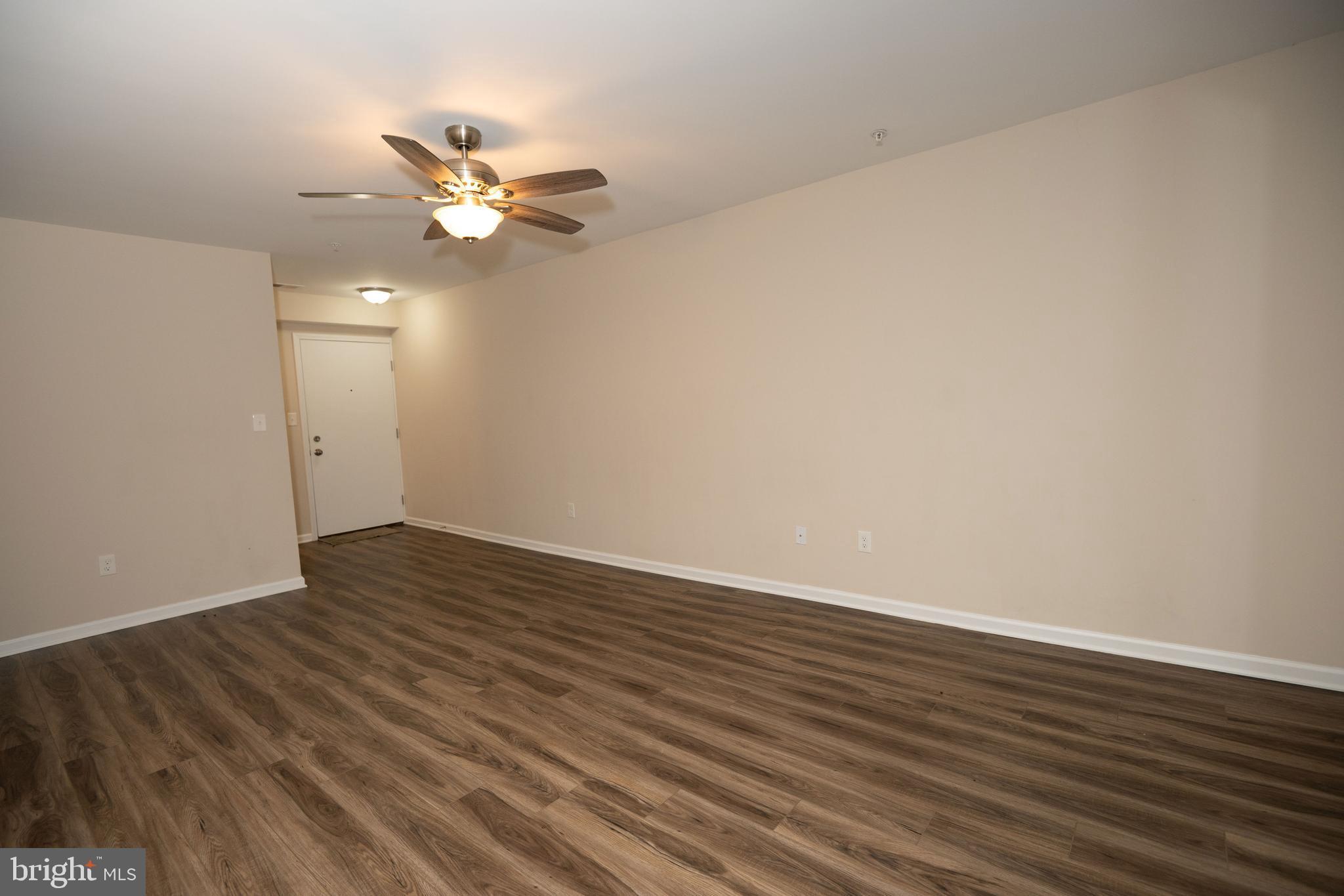 411 Stiles Avenue, Unit E3 Maple Shade, NJ 08052 - Photo 11 of 30 a view of an empty room with wooden floor