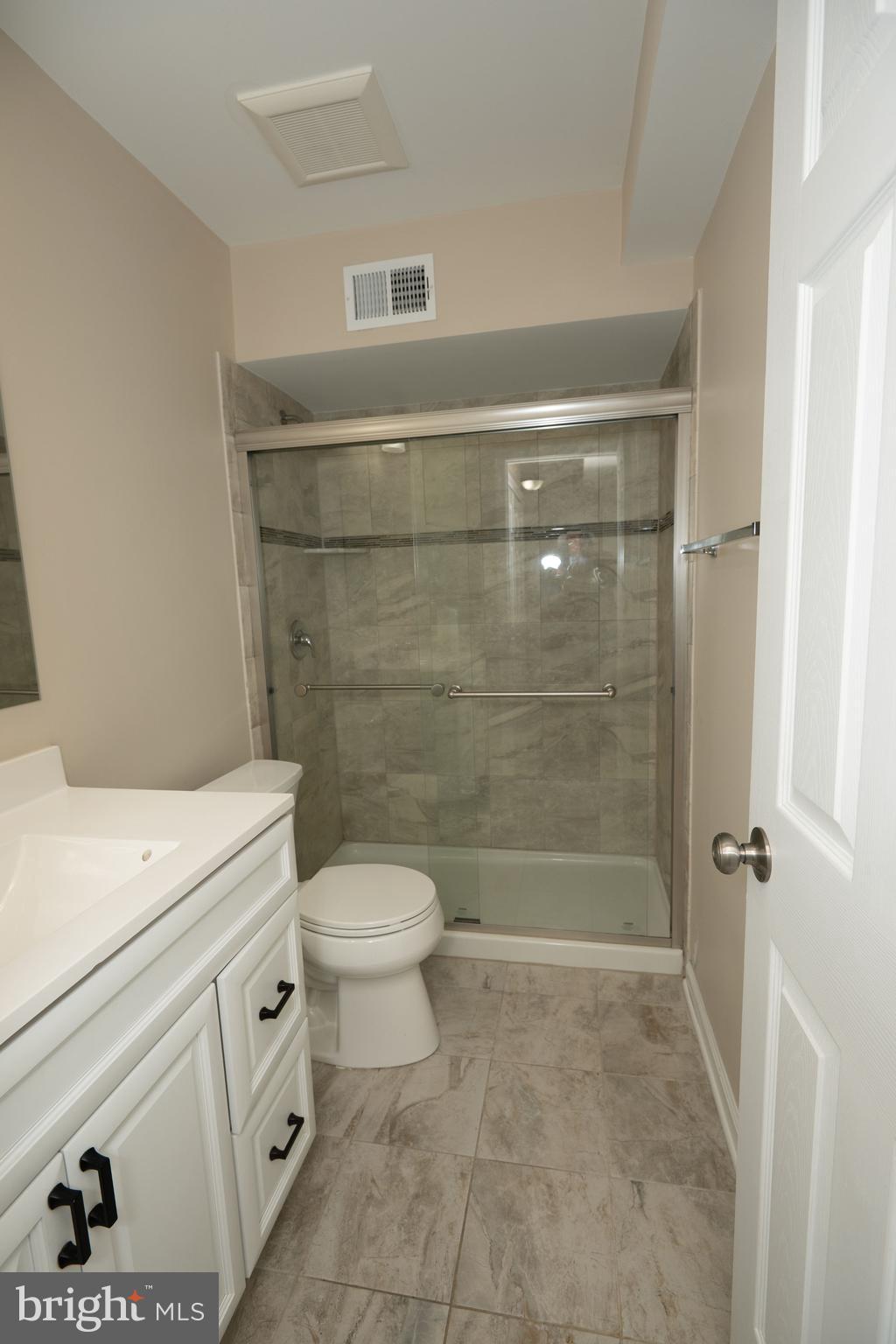 411 Stiles Avenue, Unit E3 Maple Shade, NJ 08052 - Photo 15 of 30 a bathroom with a shower a toilet and a sink