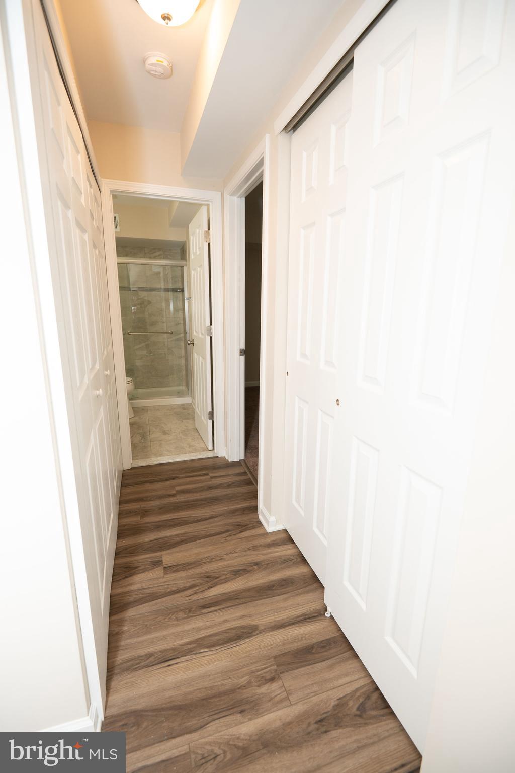 411 Stiles Avenue, Unit E3 Maple Shade, NJ 08052 - Photo 16 of 30 a view of a hallway with wooden floor and entryway