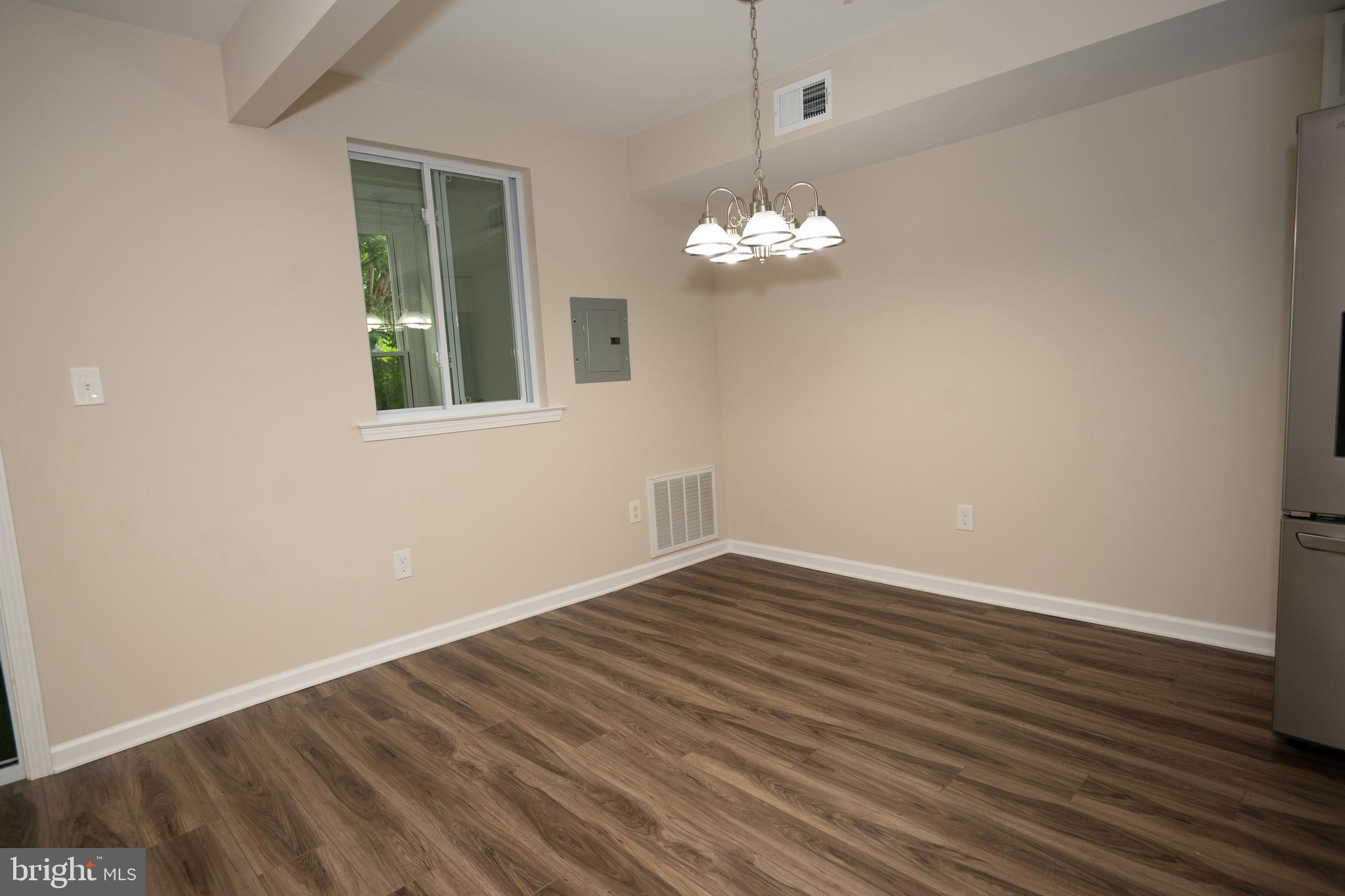 411 Stiles Avenue, Unit E3 Maple Shade, NJ 08052 - Photo 23 of 30 a view of empty room with wooden floor and fan