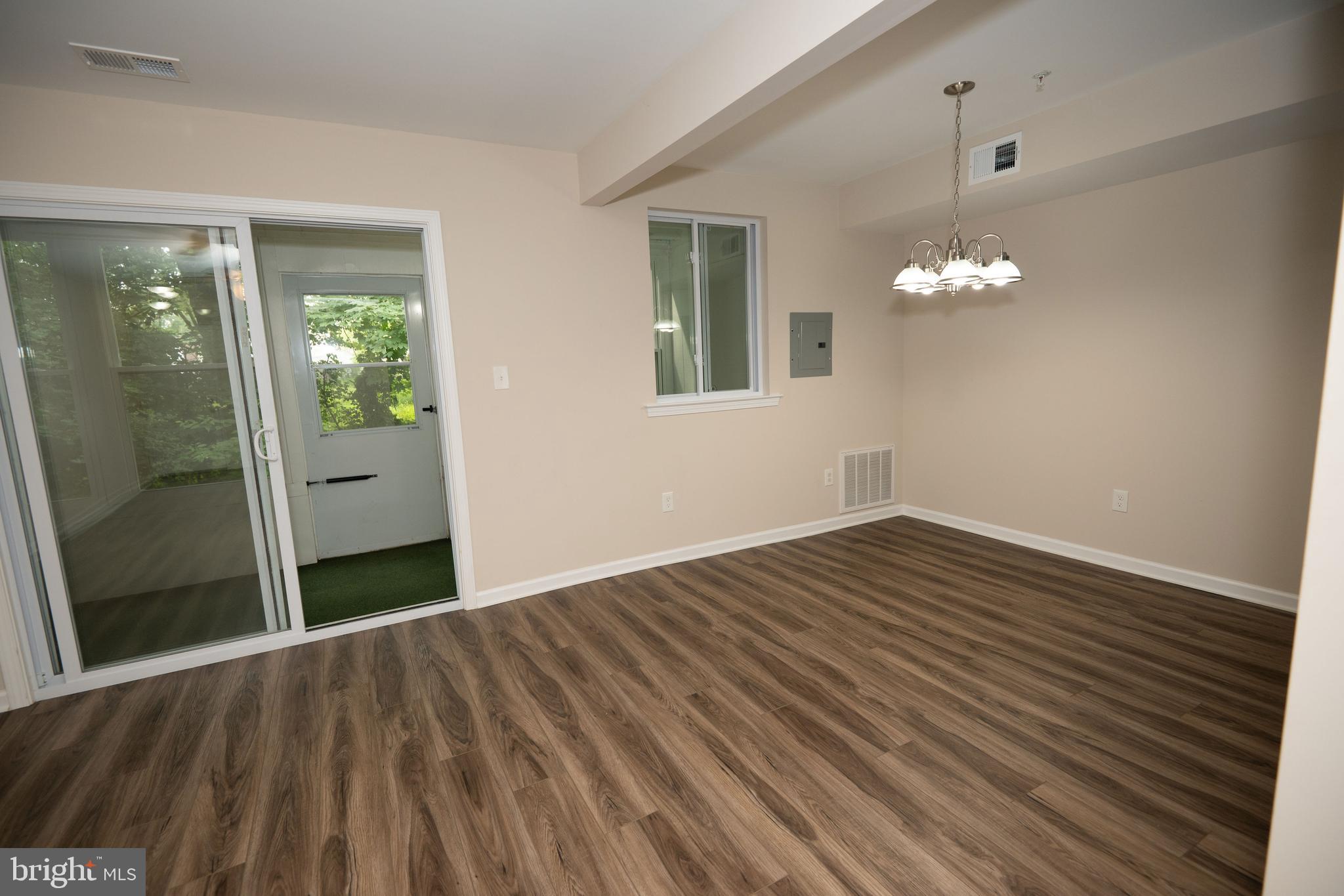 411 Stiles Avenue, Unit E3 Maple Shade, NJ 08052 - Photo 24 of 30 wooden floor in an empty room with a mirror