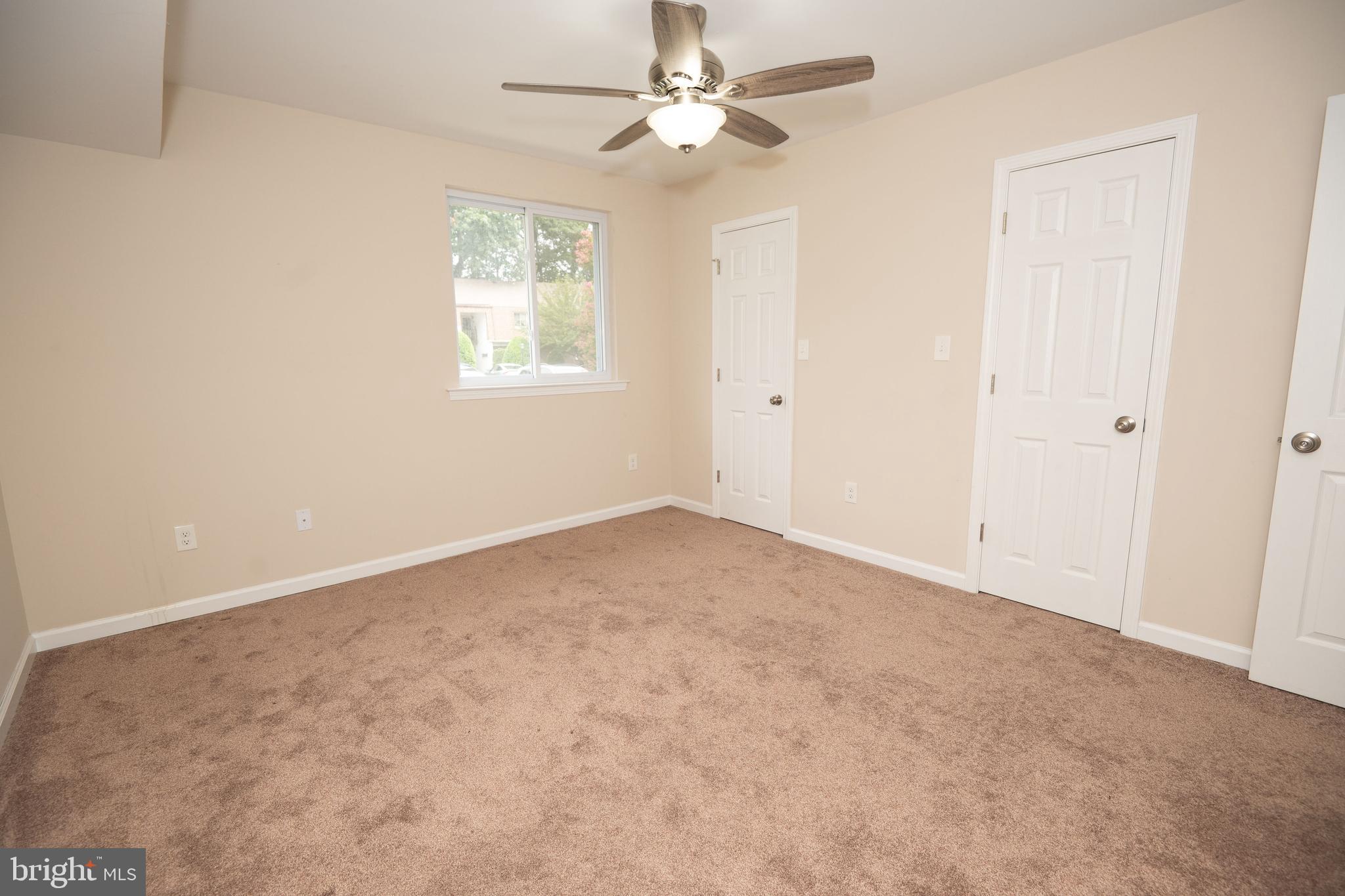 411 Stiles Avenue, Unit E3 Maple Shade, NJ 08052 - Photo 27 of 30 an empty room with windows and fan