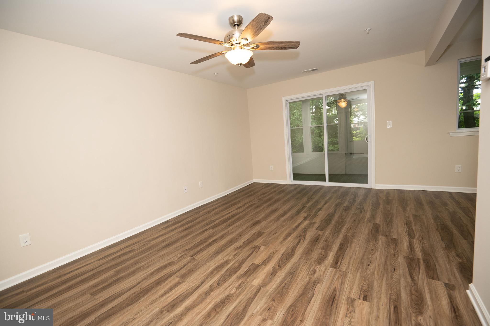 411 Stiles Avenue, Unit E3 Maple Shade, NJ 08052 - Photo 6 of 30 wooden floor in an empty room