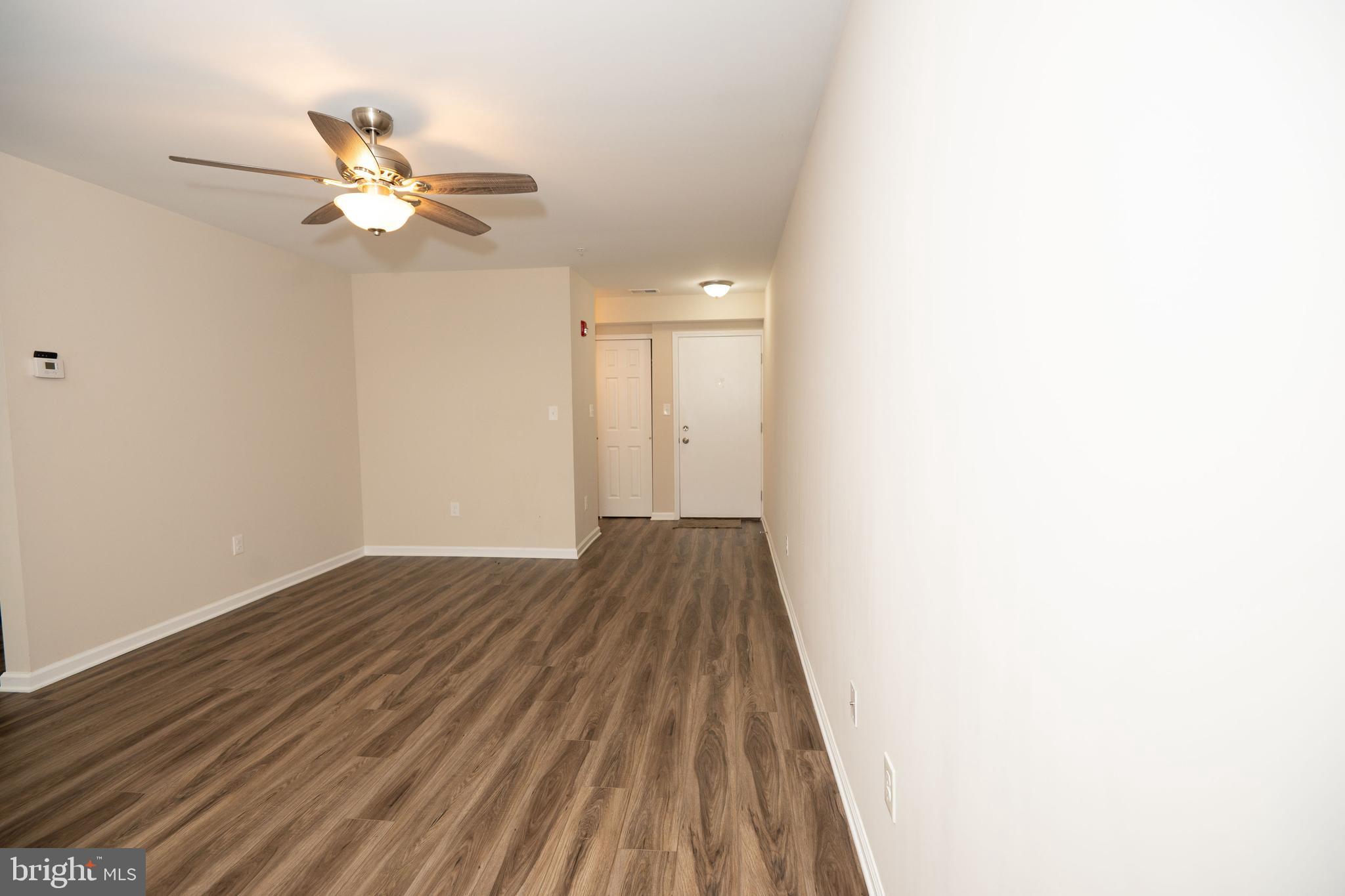411 Stiles Avenue, Unit E3 Maple Shade, NJ 08052 - Photo 10 of 30 a view of a room with wooden floor