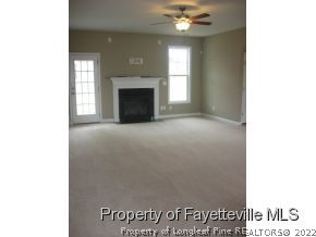 Lot 104 Carl Steiner Road Fayetteville, NC 28311 - Photo 5 of 15 a view of an empty room with window and fire place