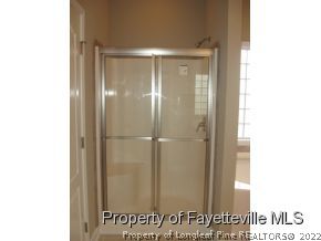 Lot 104 Carl Steiner Road Fayetteville, NC 28311 - Photo 10 of 15 a view of a bathroom with a glass door