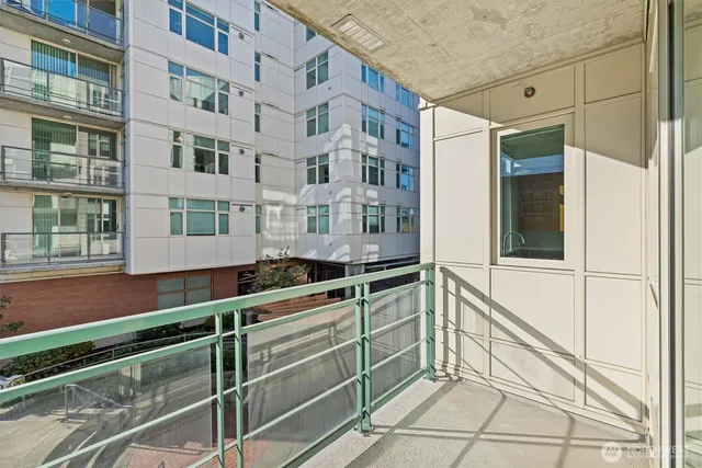 a view of a brick building next to a yard