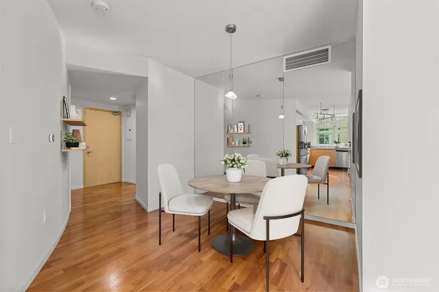 a view of a dining room with furniture and wooden floor